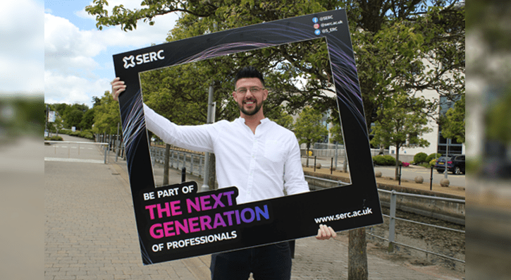 Student Kenny Galloway Holding Next Generation Photo Board